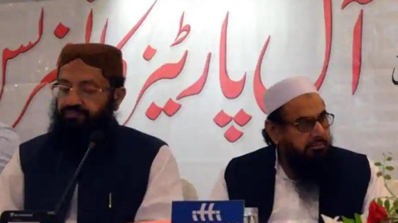 After Qureshi’s assurance against terrorism, minister attends event with Hafiz Saeed