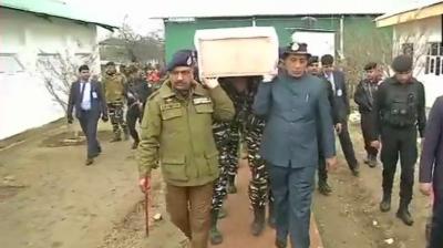 Rajnath Singh carries coffin of soldier killed in Pulwama attack